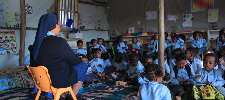 Sister Teaches Children in Temporary Classroom